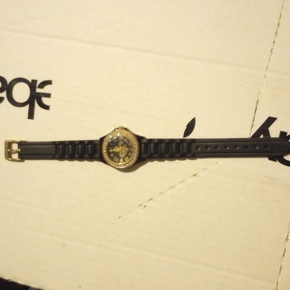 Used women's Geneva platinum saints watch